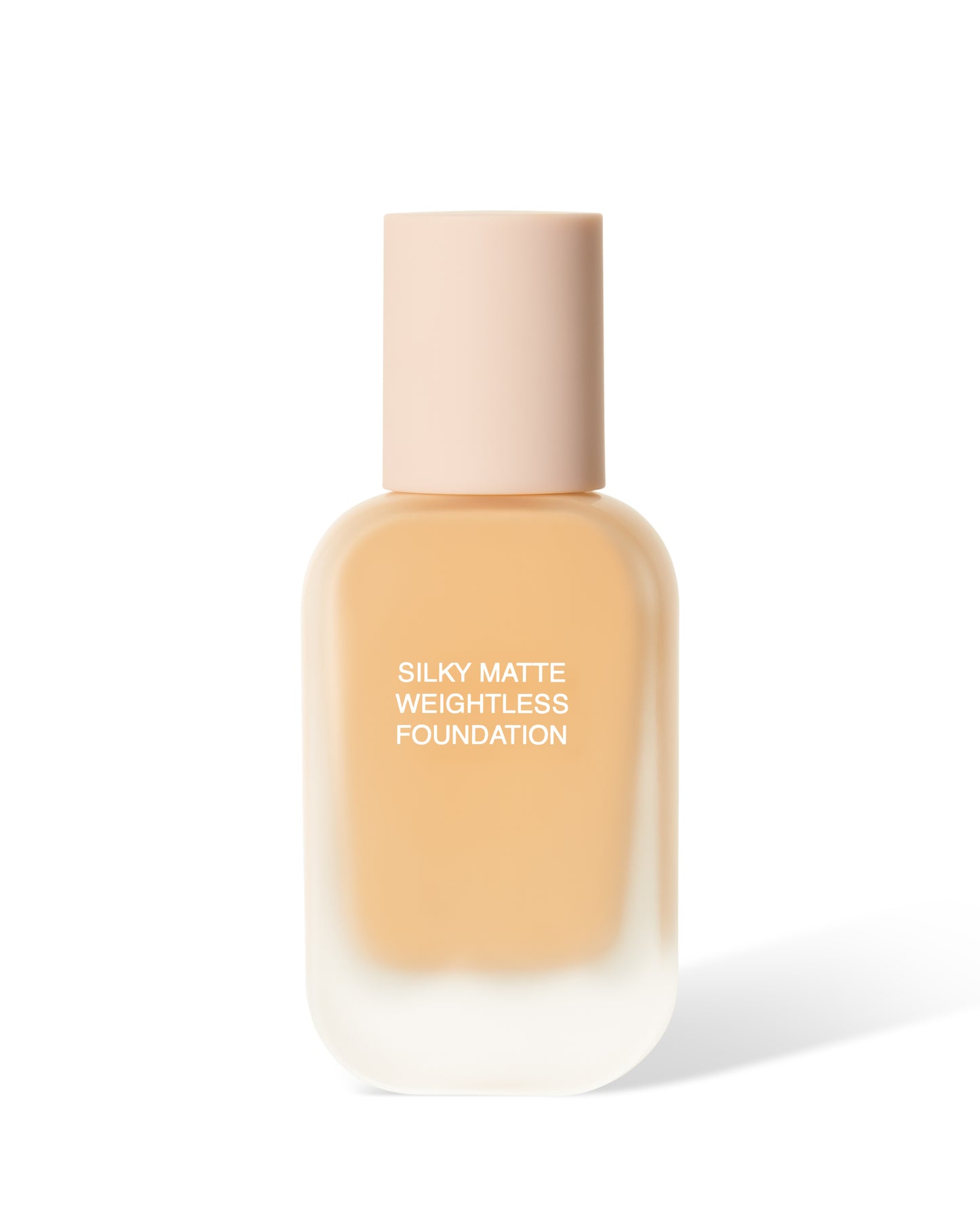 A bottle of Silky Matte Weightless Foundation. The foundation inside is a light to medium shade. 